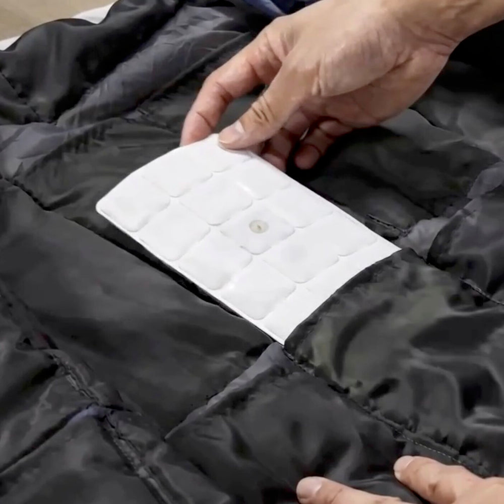 A TGPad in the pocket of a ThermoGen vest